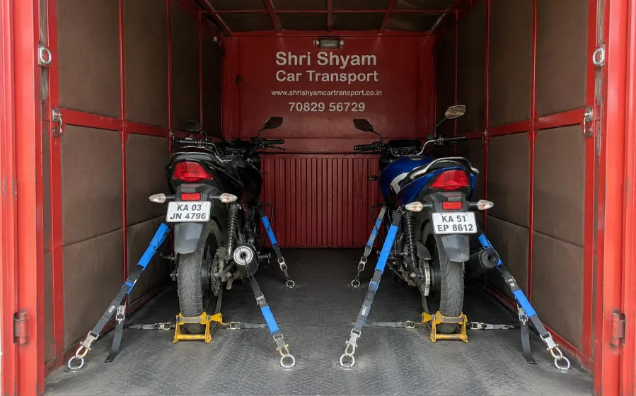 Motorcycles secured upright inside a closed bike carrier | Shri Shyam Car Transport